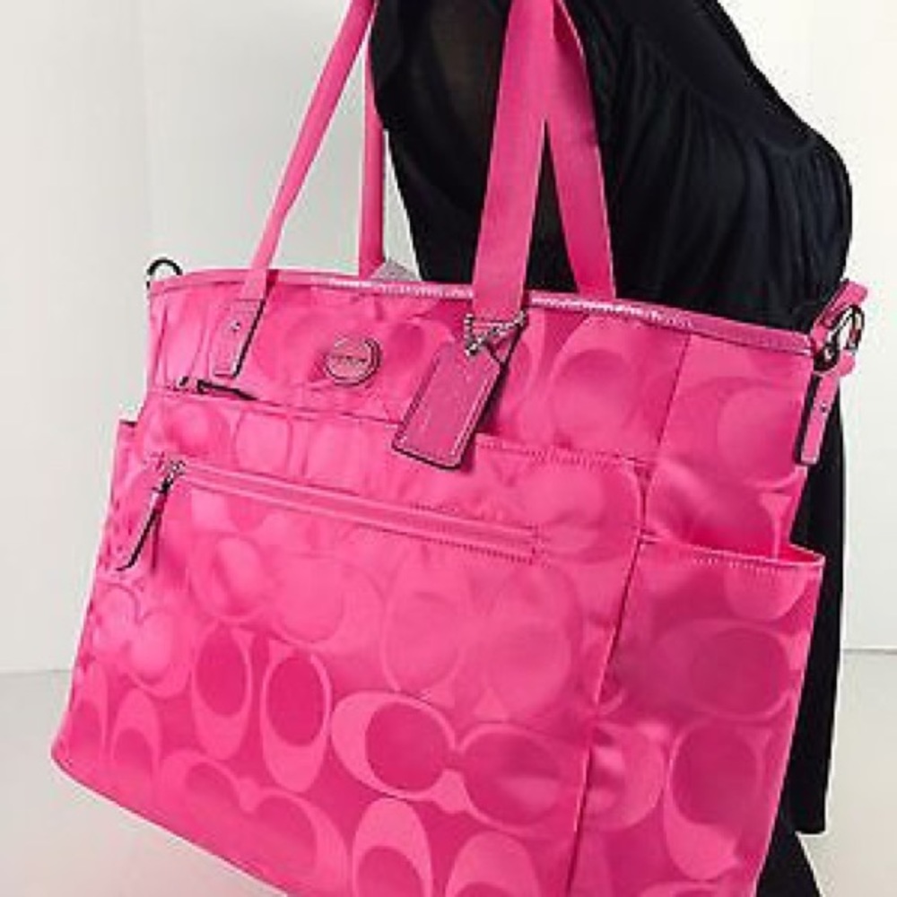Coach diaper bag with hot pink changing pad